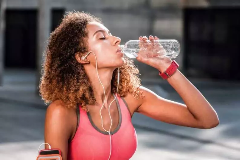 so refreshing nice thirsty woman holding bottle while drinking fresh bottle